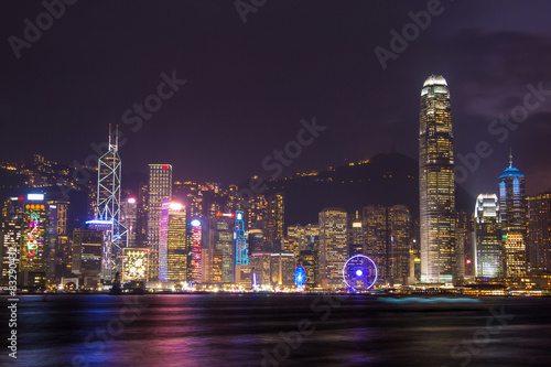 illuminated skyscrapers in victoria harbor,hongkong.