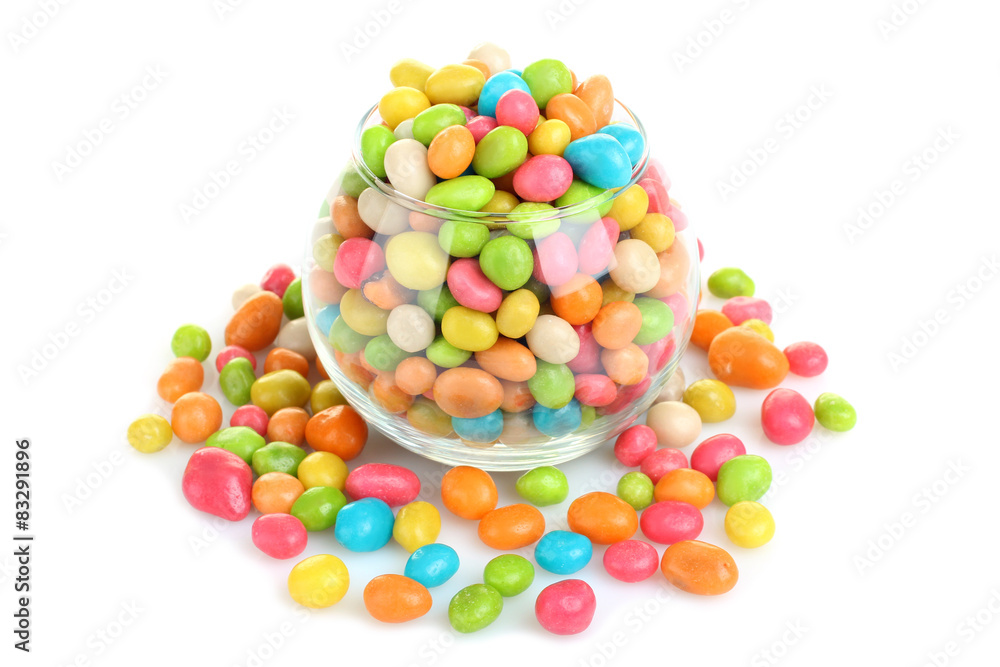 Colorful candies in glass bowl isolated on white Colorful candies in glass bowl isolated on white