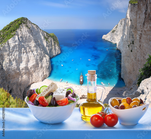 Fototapeta Naklejka Na Ścianę i Meble -   Navagio beach with Greek salad in Zakynthos, Greece
