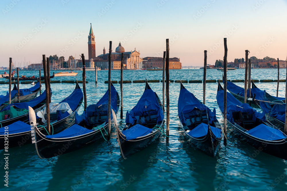 Gondolas moored by Saint Mark in sunset ,Venice, Italy 