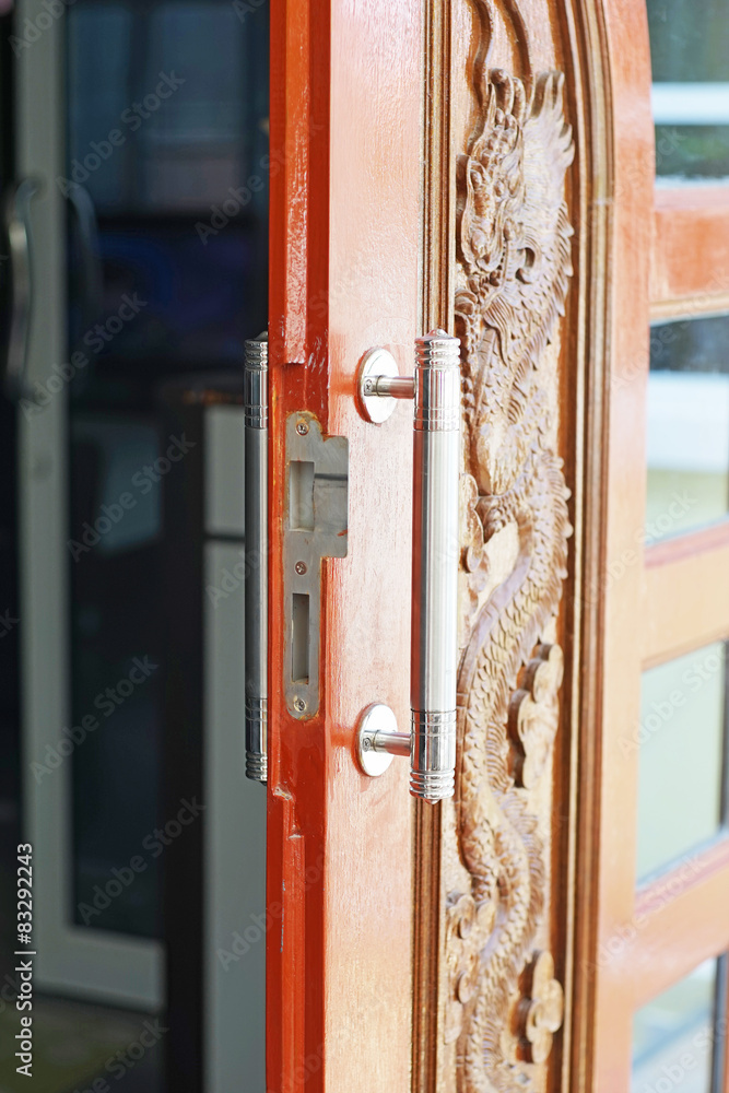 opened wooden door with modern handle