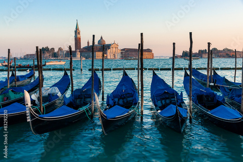 Gondolas moored by Saint Mark in sunset ,Venice, Italy  © ugiss