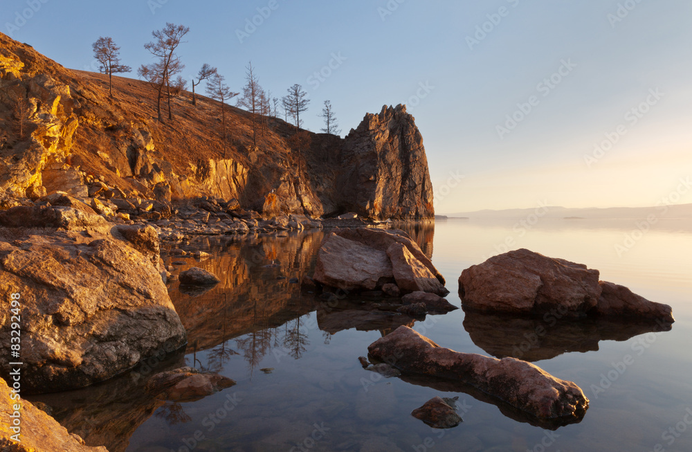 Lake Baikal. Bright colors of spring sunset on coastal cliffs