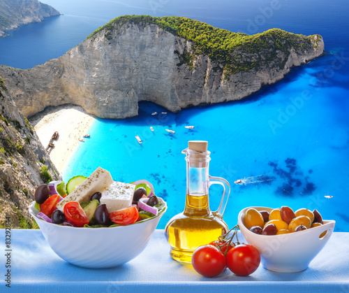 Fototapeta Naklejka Na Ścianę i Meble -   Navagio beach with Greek salad in Zakynthos, Greece