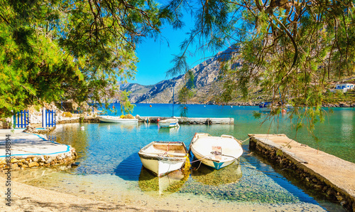 Quadro su tela Haven with boats in sea bay , Greece