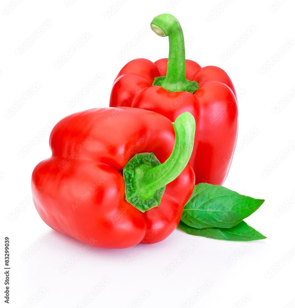 Two Red Peppers with green leaves isolated on white background Two Red Peppers with green leaves isolated on white background