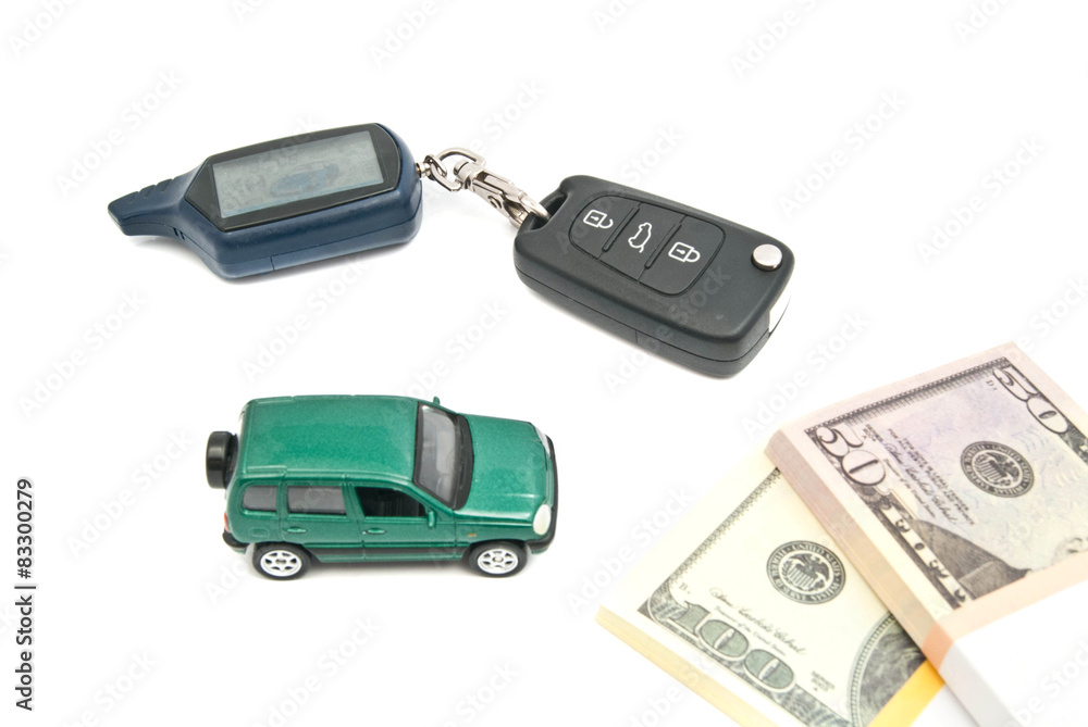 green car, keys and money on white green car, keys and money on white