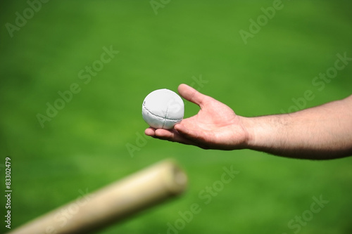 фотографія Hand holding a rounders ball