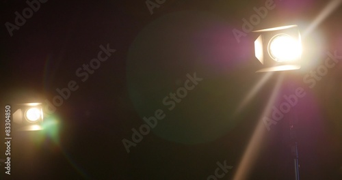 Setting up the scene for an interview, moving the lights