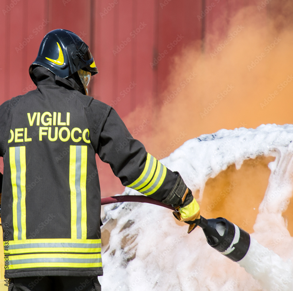 Fototapeta premium firefighters in action with foam