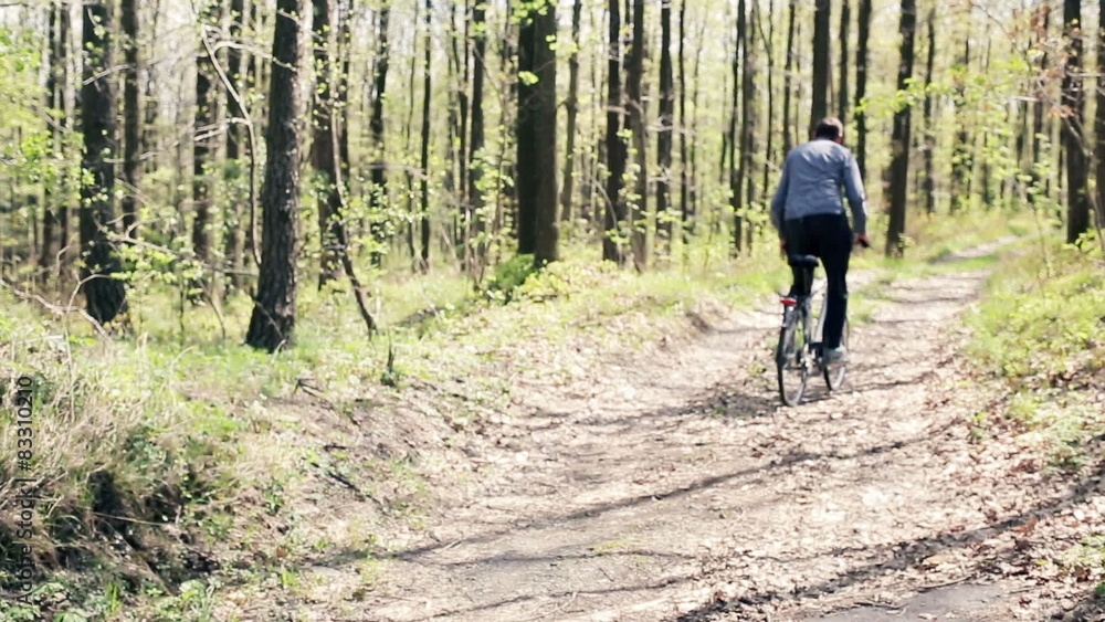 Young man riding bike on a country road
Young man riding bike on a country road