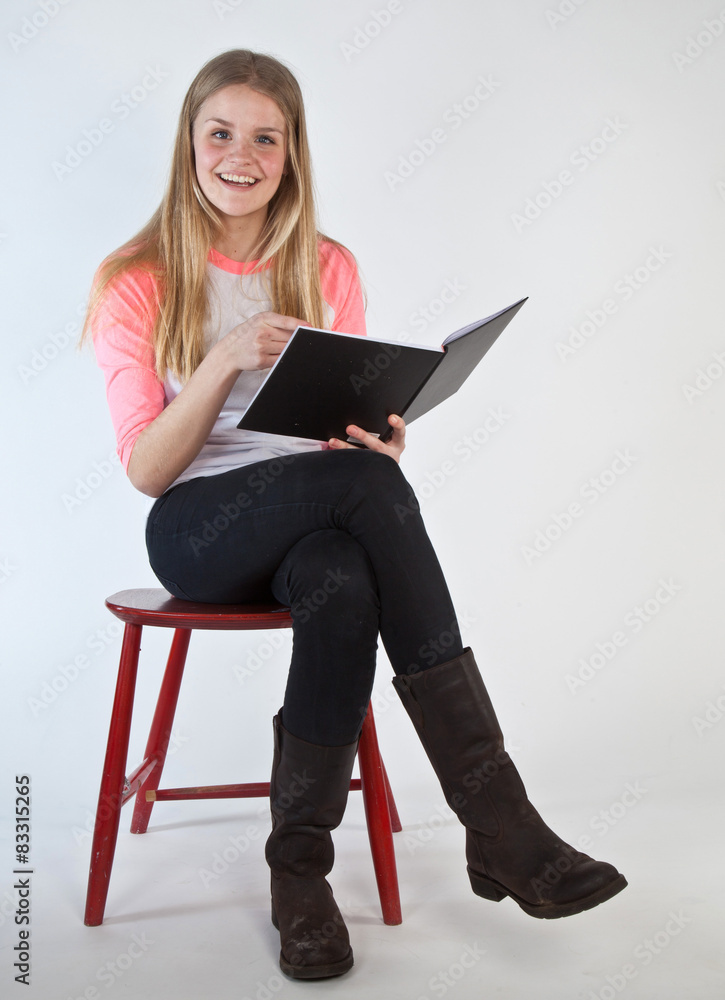 Scandinavian cute young girl reading a book Scandinavian cute young girl reading a book