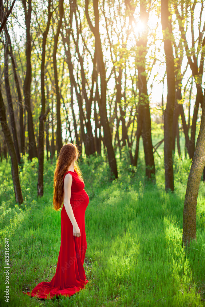 Young pregnant woman relaxing and enjoying life in nature Young pregnant woman relaxing and enjoying life in nature