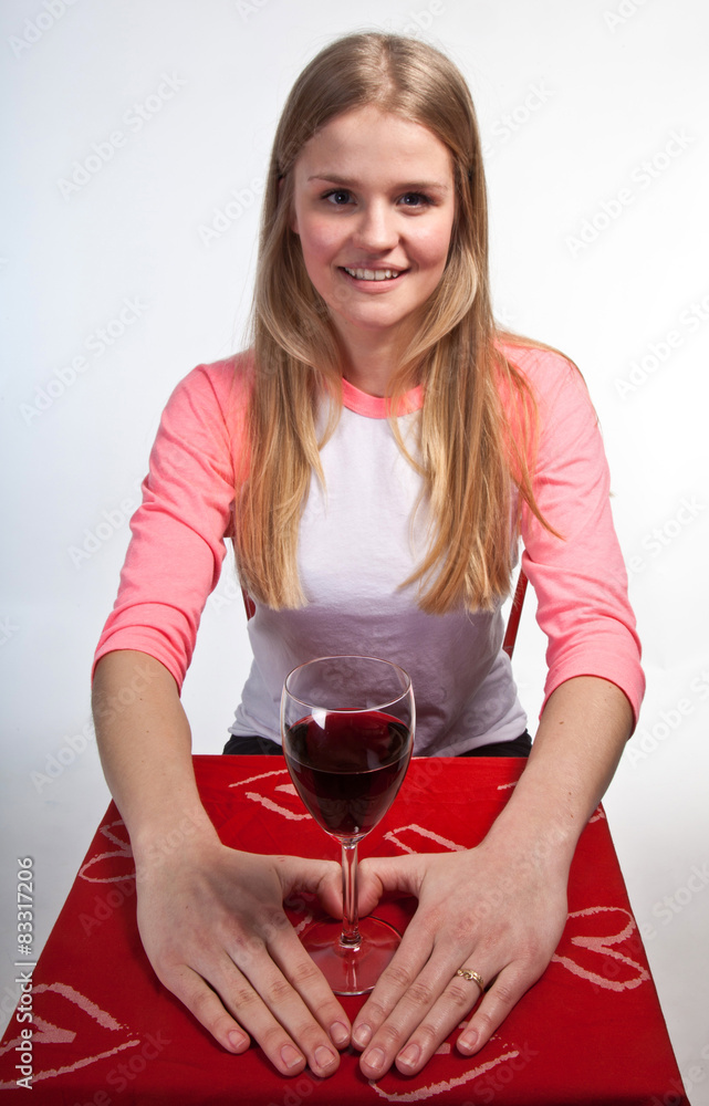Scandinavian cute young girl hands shaping a heart and wine glas Scandinavian cute young girl hands shaping a heart and wine glas