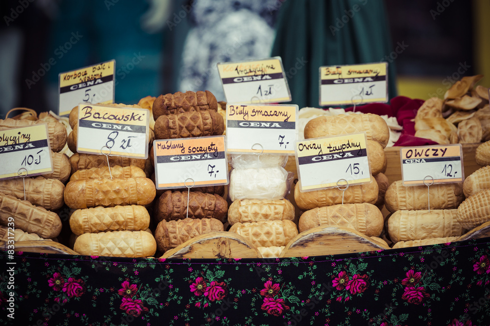 Traditional polish smoked cheese oscypek on outdoor market in Za Traditional polish smoked cheese oscypek on outdoor market in Za