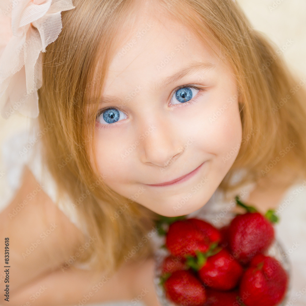Portrait of a beautiful little girl with strawberry Portrait of a beautiful little girl with strawberry