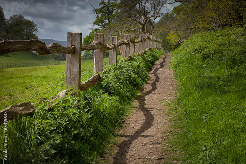 A rustic old wooden fence beside a path in Brecon, south Wales