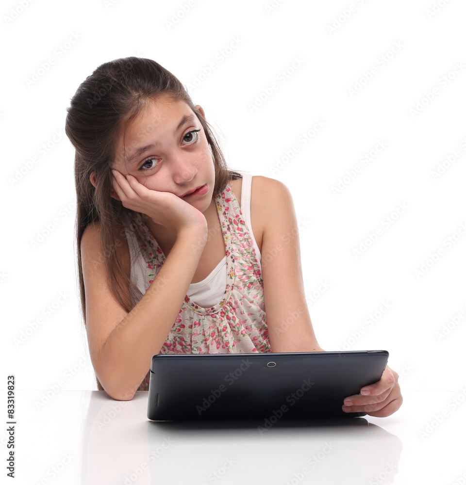 Boring. Pre-teen girl with a tablet computer. Boring. Pre-teen girl with a tablet computer.