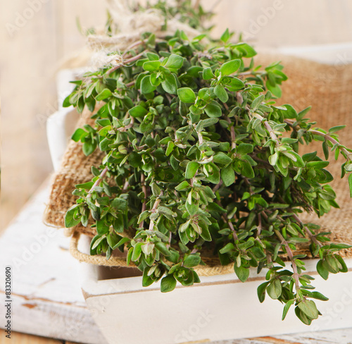 Thyme and oregano in a white wooden box.