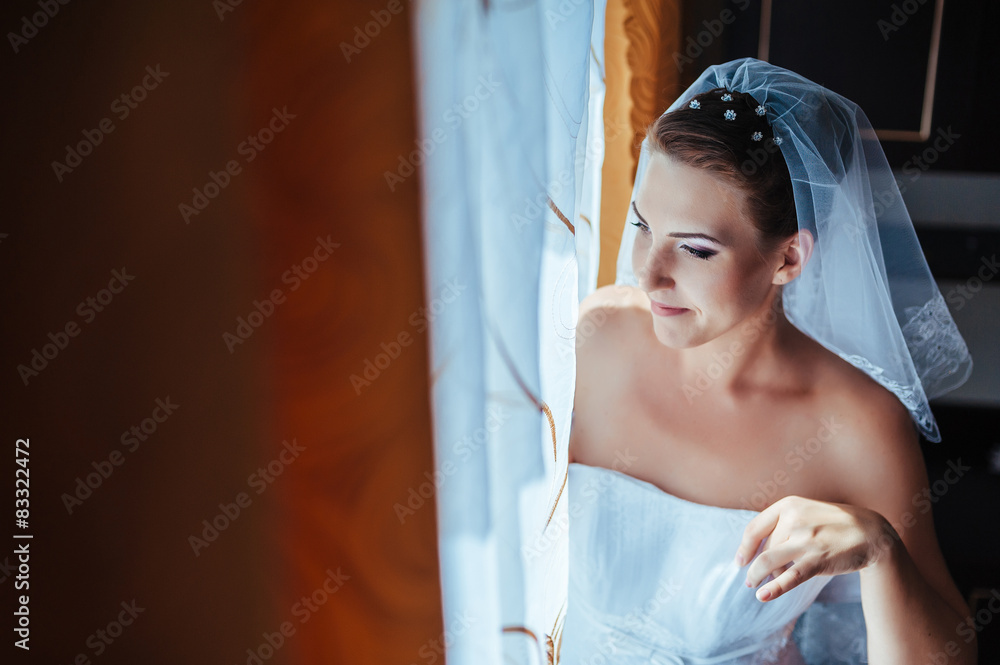 Fototapeta premium Bride getting ready. beautiful bride in white wedding dress with