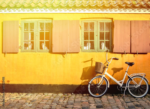 Canvas Print Bicycle in front of the entrance to an apartment in one of the h