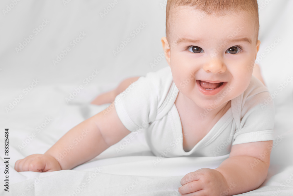 Cute smiling baby boy on white background