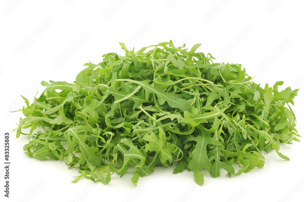 fresh rucola leaves (Eruca sativa) on a white background fresh rucola leaves (Eruca sativa) on a white background