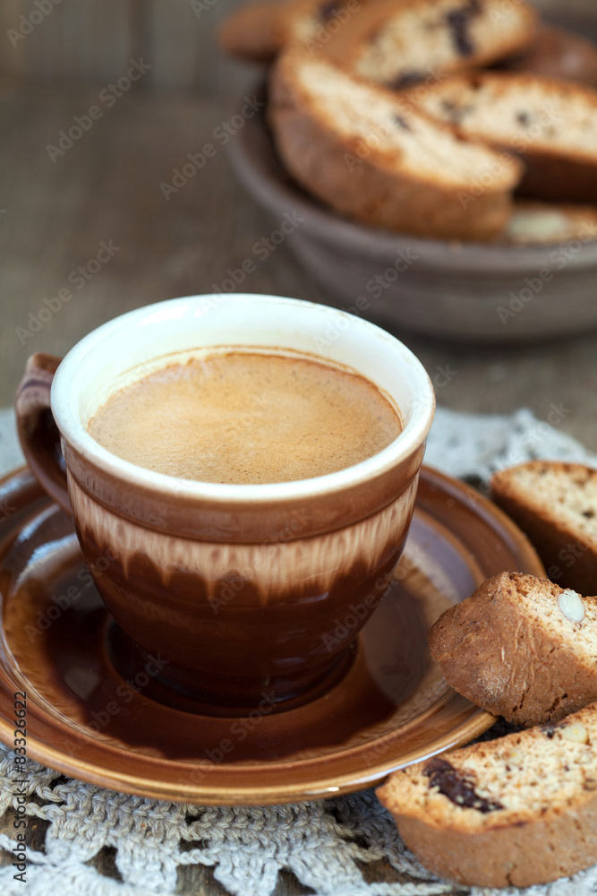 Cup of coffee and a handful of homemade biscotti with chocolate Cup of coffee and a handful of homemade biscotti with chocolate