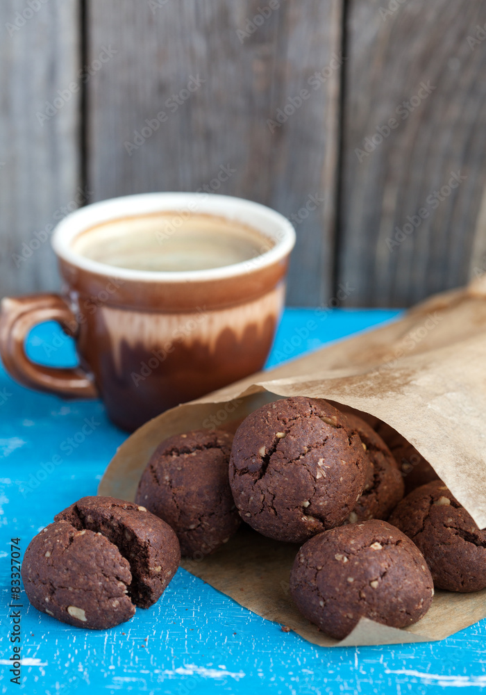 Italian chocolate cookies with walnuts and a cup of coffee Italian chocolate cookies with walnuts and a cup of coffee