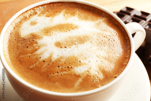 Cup of coffee latte art, closeup
