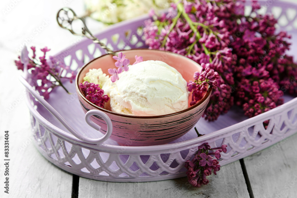 Beautiful composition with tasty ice cream and lilac flowers Beautiful composition with tasty ice cream and lilac flowers