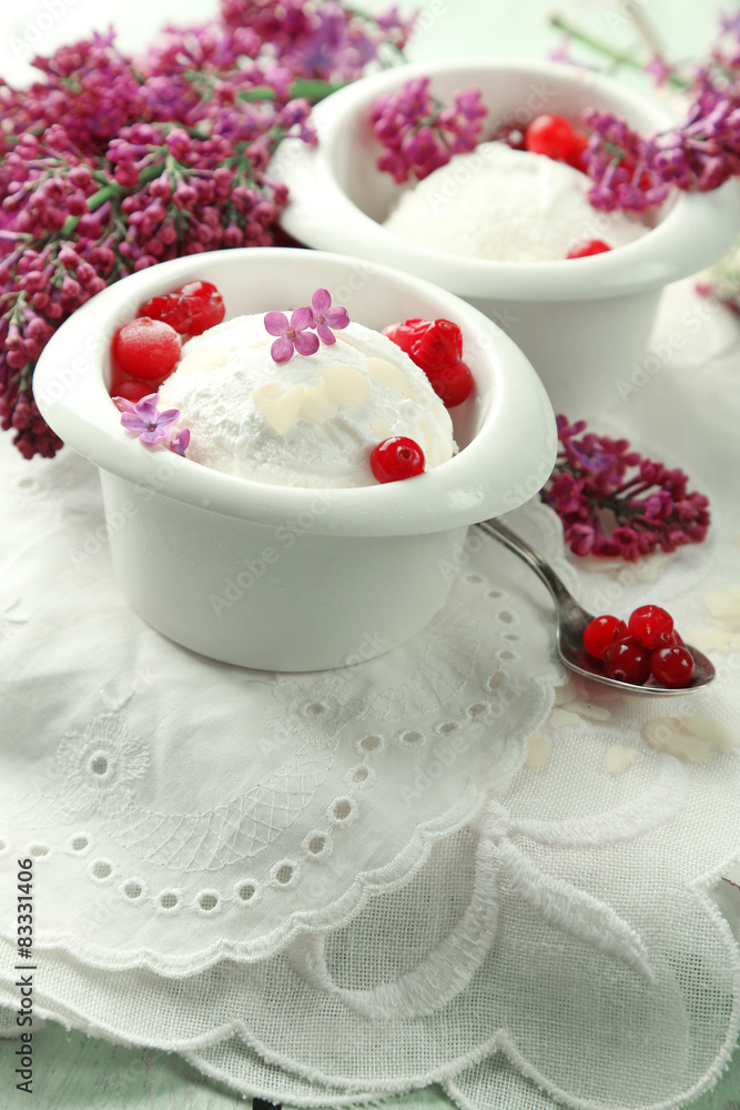 Beautiful composition with tasty ice cream and lilac flowers Beautiful composition with tasty ice cream and lilac flowers