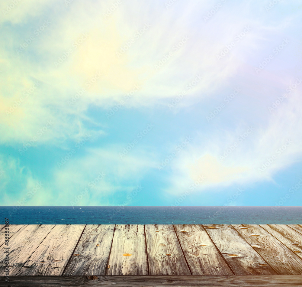 Sea and sky against wooden floor Sea and sky against wooden floor