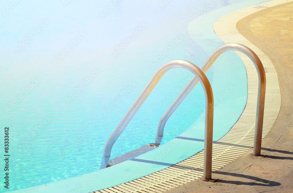 Swimming pool in curved shhape with stairs Swimming pool in curved shhape with stairs