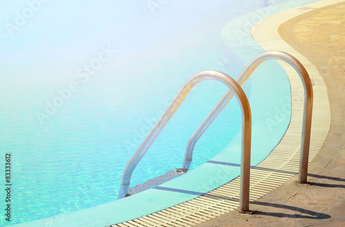 Swimming pool in curved shhape with stairs © irishmaster
