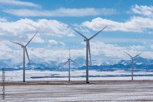 Wind Turbines with Rocky Mountains in the Winter