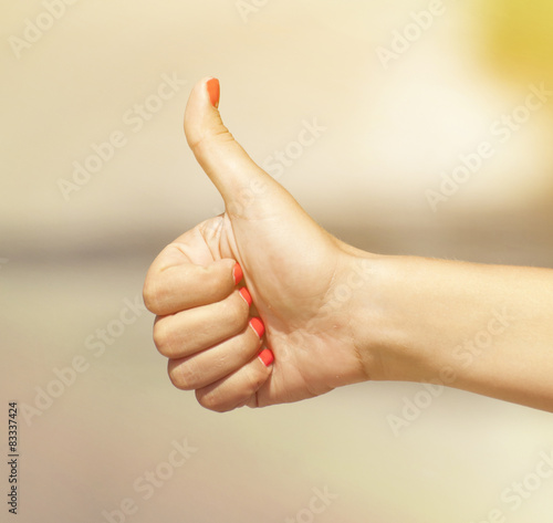 Woman hand hitchhiking