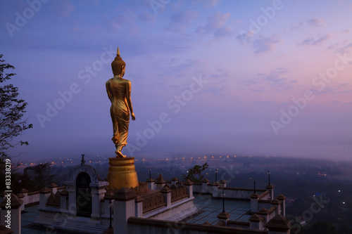 Buddha statue standing at Wat Phra That Khao Noi in Nan Thailand