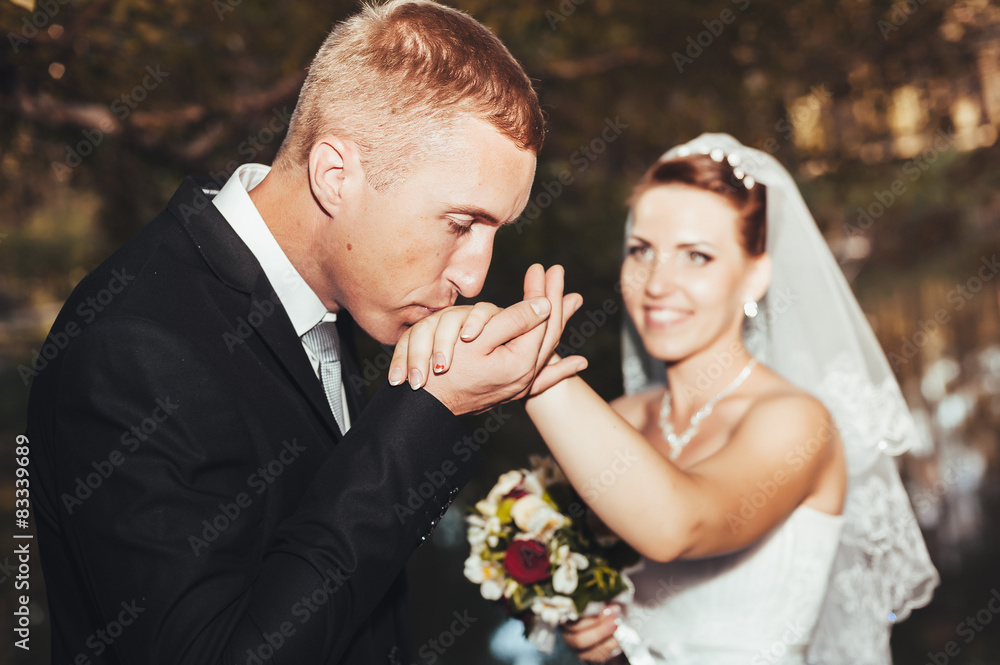 A wedding by the sea. Honeymoon. The bride and groom hugging on A wedding by the sea. Honeymoon. The bride and groom hugging on