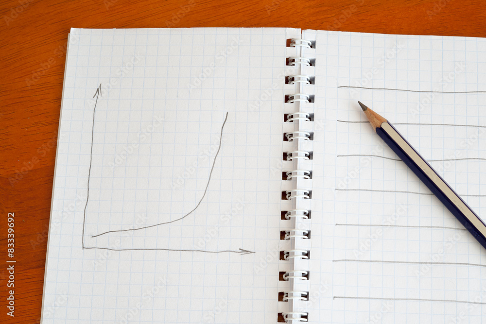 pencil on a notebook pencil on a notebook