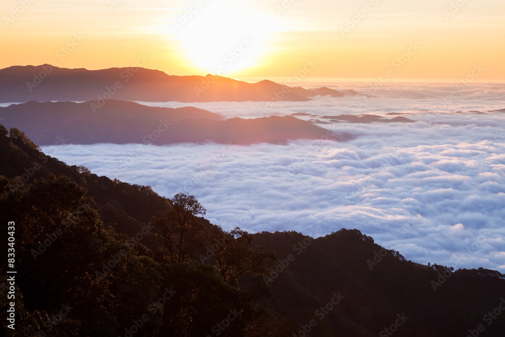 Clouds like sea and waterfall in high mountain. Sunrise at Doi P