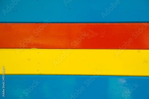 Some bright multi-colored wooden planks arranged horizontally