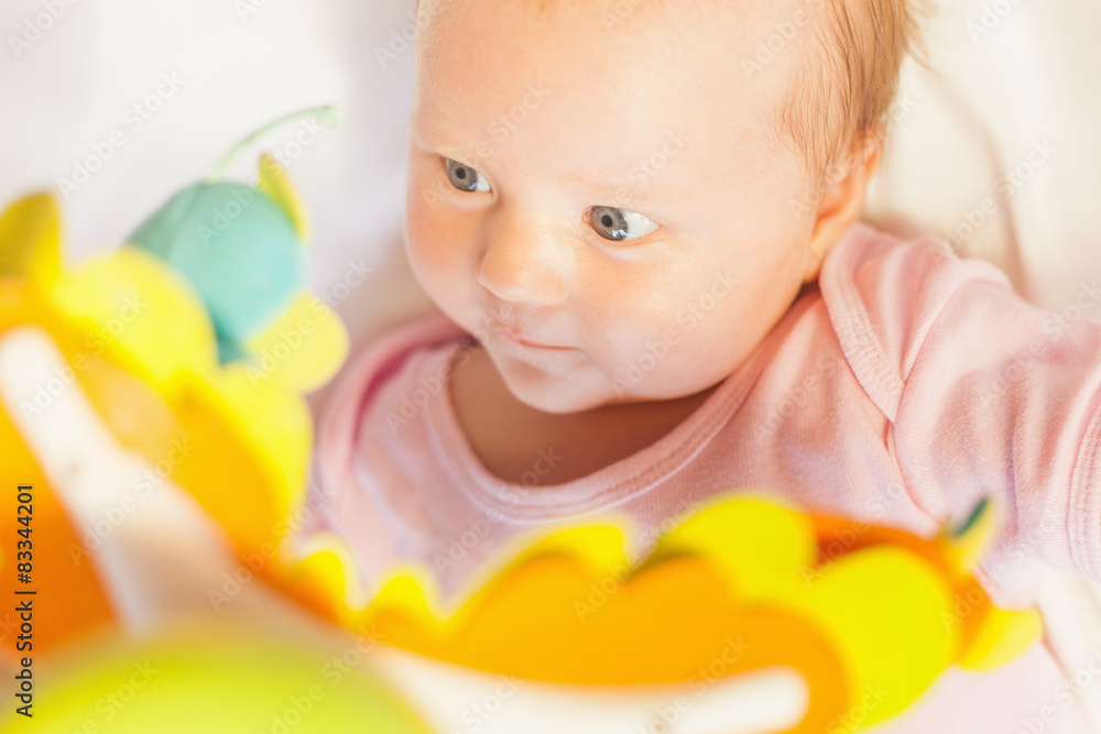 happy baby playing with children's musical mobile toy happy baby playing with children's musical mobile toy