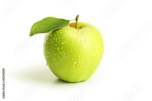 Green apple with leaf isolated on white