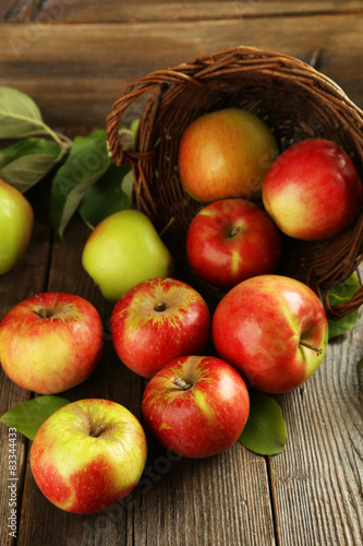 Beautiful apples on brown wooden background