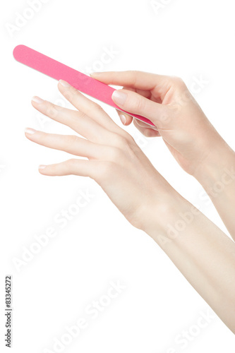 Female hands manicure with nail file isolated on white, clipping