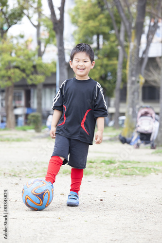 Obraz na płótnie サッカーする子供 w salonie
