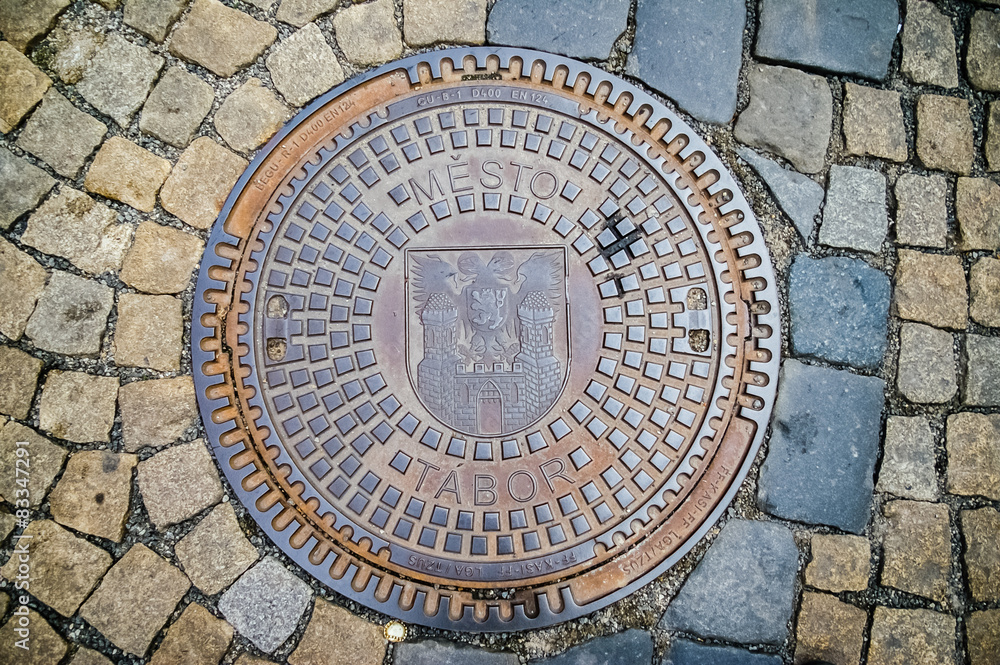 Hatch of sewage on the paving road