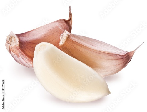 Peeled garlic clove isolated on a white background.