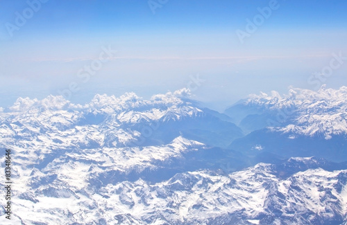 Aerial view of snow clad French Alpes from the air. © artesiawells